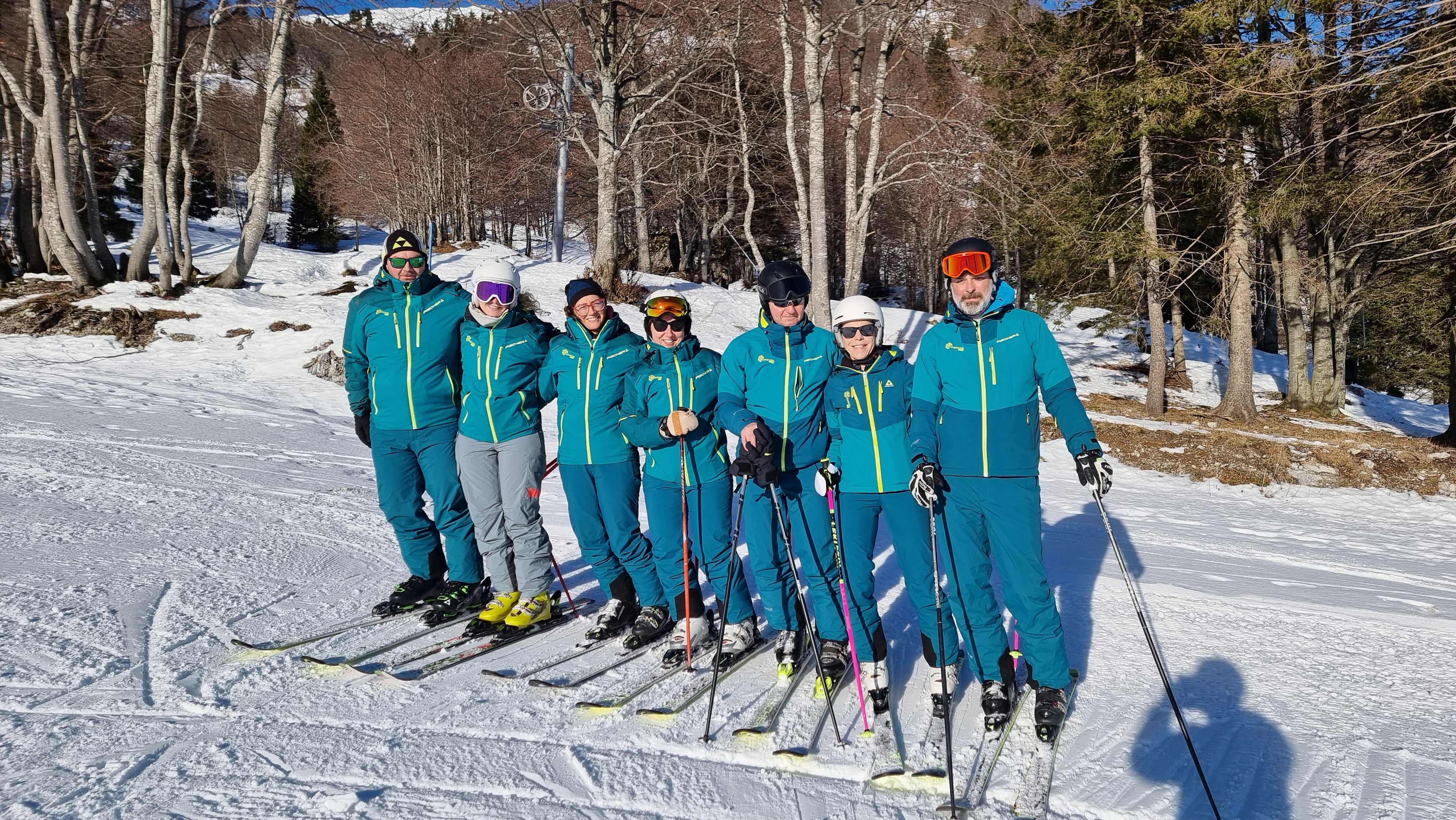 Ski instructors with students